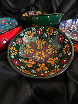 Small 10 cm handmade Turkish ceramic bowl showing colourful handpainted surface and unique texture