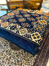 Side view of navy Ottoman floor cushion showing the firm sponge filling and 20 cm height