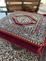 Side profile of maroon Ottoman floor cushion showing firm sponge filling and 20 cm squared height