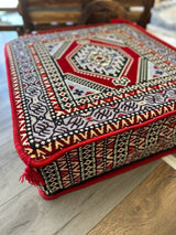 Side profile of red Ottoman floor cushion showing firm sponge filling and 20 cm squared height