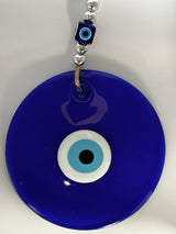 Evil eye wall hanging styled above a console as a new home gift idea and house protection charm