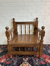 Single dark rustic wood majlis seat with grounded low frame handmade in Gaziantep Turkey for traditional seating