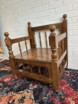 Low dark majlis seat in rustic wood from the side showing 90 cm height and open space beneath the timber frame