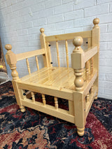 Low light majlis seat in rustic wood from the side showing 90 cm height and open space beneath the pale timber frame