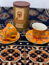 Orange Turkish coffee cups in artisan ceramic, warm-toned set styled together for serving coffee at the table