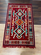 Red Turkish cotton kilim rug laid flat showing its classic warm colour and flat woven 100% cotton surface
