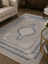 Close detail of Kervan AK187 gray and blue Turkish rug pile texture showing 12 mm height and woven blue detail