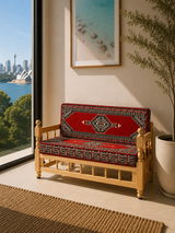 Red palace sedir cushion set with rustic wood chair and warm red cotton cushions for low Turkish majlis seating