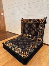 Two-piece navy elegance floor cushion set laid out for a composed Turkish majlis floor seating corner