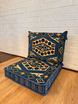 Two-piece blue classic floor cushion set laid on floor with seat and back cushion for grounded Turkish seating
