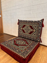 Two-piece dark red palace floor cushion set laid out for ornate Turkish majlis floor seating