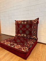 Two-piece maroon elegance floor cushion set arranged on the floor for refined Turkish majlis seating