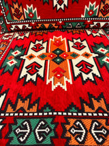 Close view of red oriental floor cushion showing detailed oriental pattern and firm sponge filled cotton cover