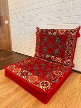 Two-piece red elegance floor cushion set arranged on the floor for a refined Turkish majlis seating corner