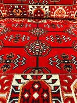 Close detail of red elegance floor cushion showing rich red cotton weave and firm sponge filled seam edge