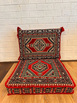 Red palace floor cushion set with ornate palace motif on warm red cotton seat base and matching backrest