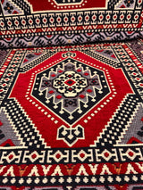 Close view of red palace floor cushion showing detailed palace pattern and firm sponge filled cotton cover