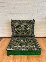 Green floor cushion set with square cotton seat base and matching backrest arranged for relaxed floor seating