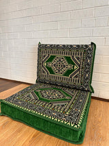 Two-piece green floor cushion set laid on floor with seat and back cushion for calm Turkish majlis seating