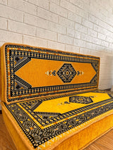 Detail of yellow palace floor cushion cover stitching and firm sponge fill in bright cotton fabric