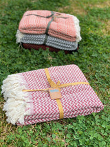 Handwoven red Turkish cotton throw in 100% natural cotton draped to reveal its rich warm colour and soft surface