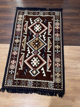Brown Turkish cotton kilim rug laid flat showing its warm earthy tones and flat woven cotton surface